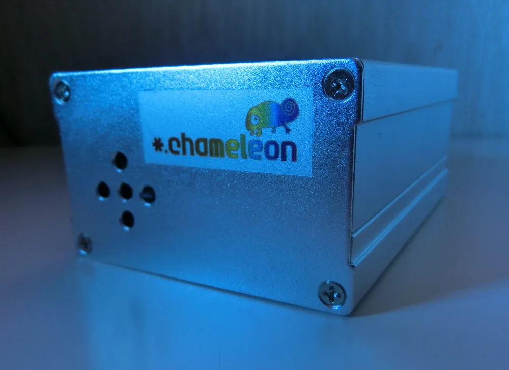 co2.chameleon in its aluminum case, lit by blue light