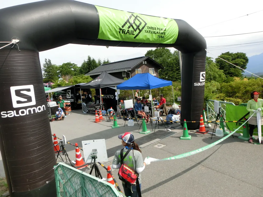 The finish gate and check-in area of a trail race